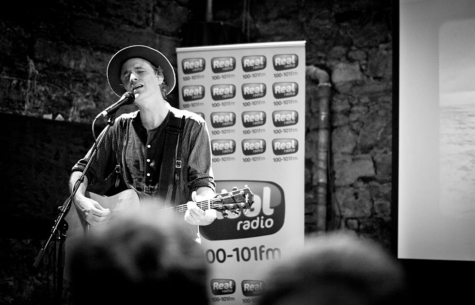Man playing acoustic guitar and singing